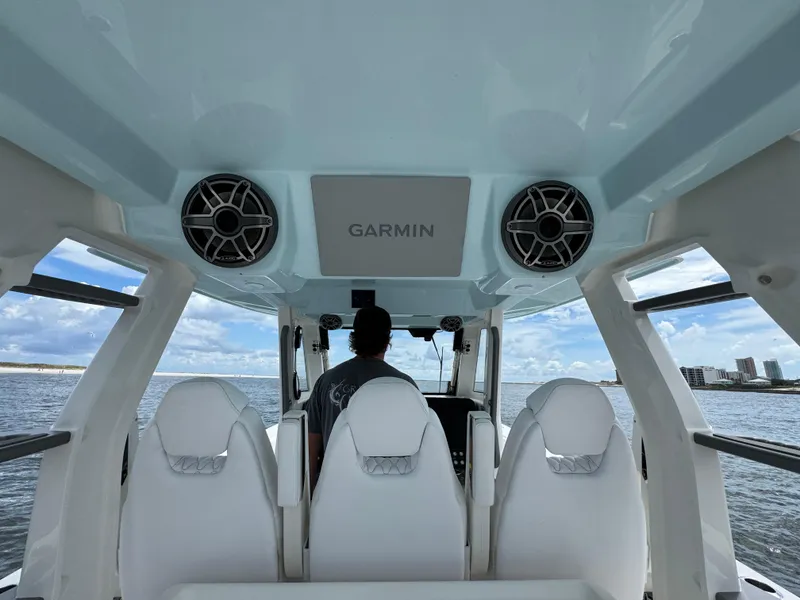 Slide: The Image of Interior view of 2026 Solace 37 CS boat with white seats and Garmin equipment. - 45