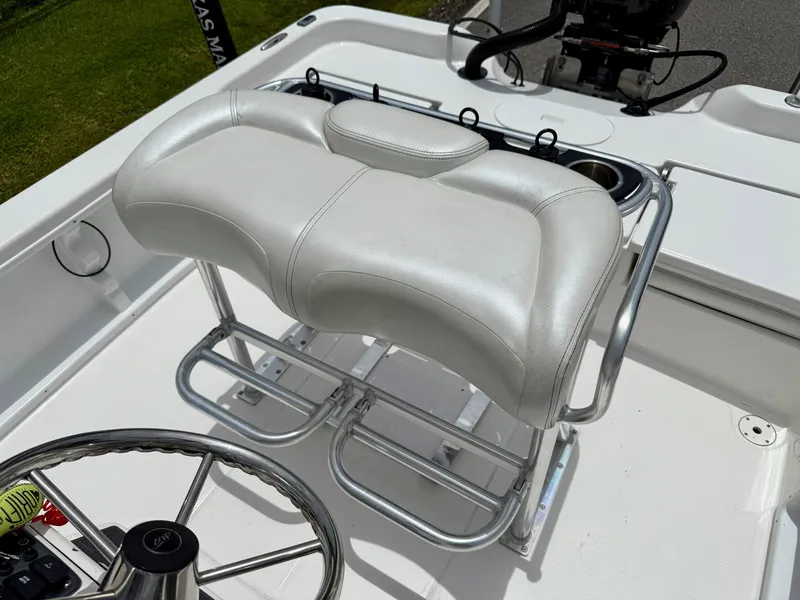 Slide: The Image of White leather seating on 2017 Blue Wave 2000 PureBay boat, featuring steering wheel and controls. - 10