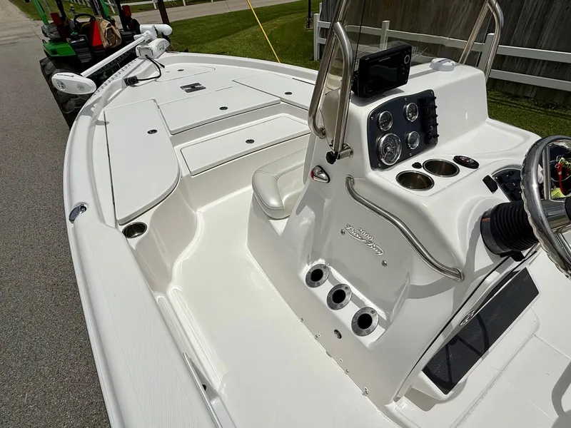 Slide: The Image of 2017 Blue Wave 2000 PureBay boat interior with steering console and seating. - 12