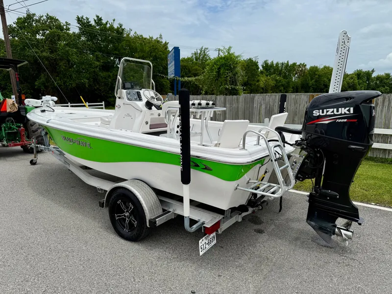 Slide: The Image of 2017 Blue Wave 2000 PureBay boat with Suzuki outboard motor on trailer. - 2