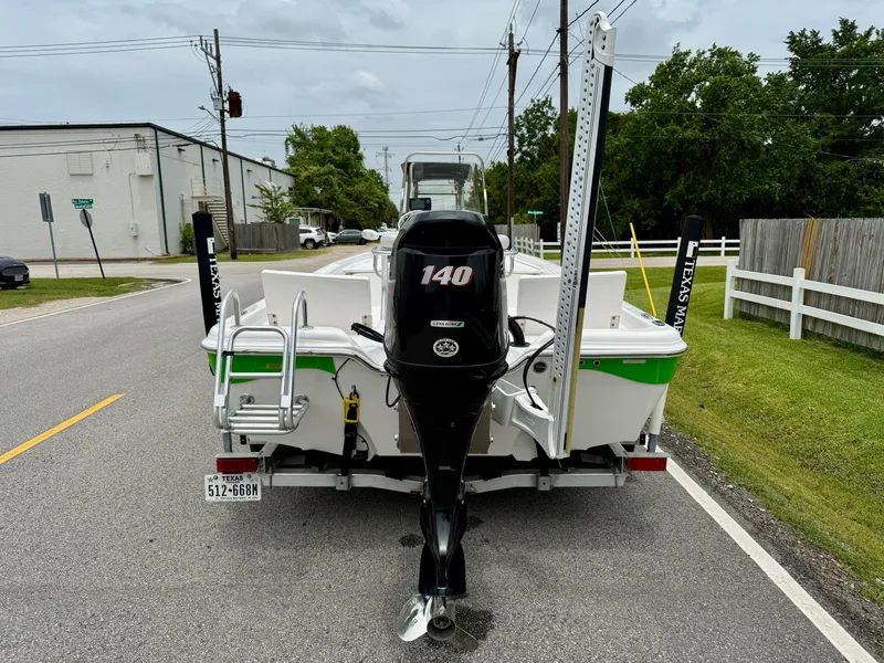 Slide: The Image of 2017 Blue Wave 2000 PureBay boat with 140 HP engine on a trailer. - 3