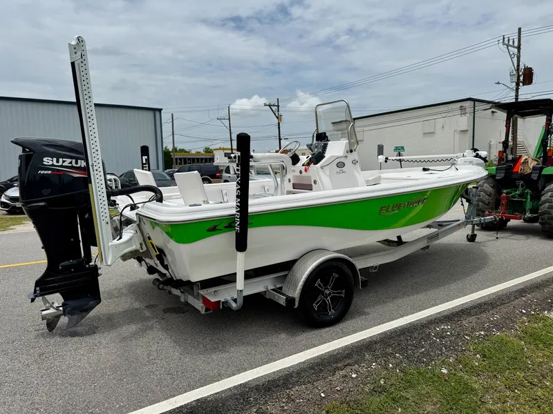 Slide: The Image of 2017 Blue Wave 2000 PureBay boat on trailer with Suzuki outboard motor. - 4