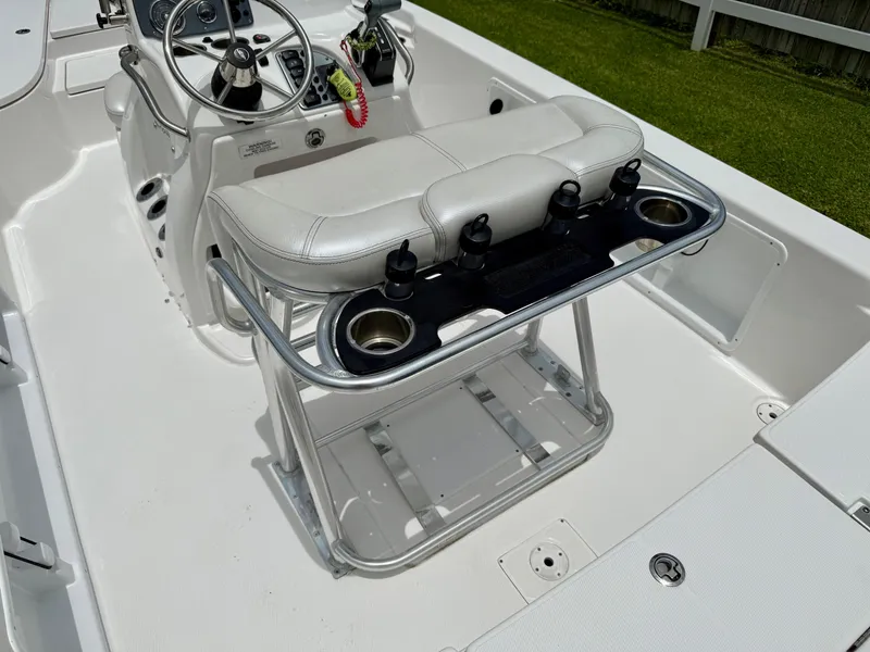 Slide: The Image of 2017 Blue Wave 2000 PureBay boat interior with steering console and seating. - 9