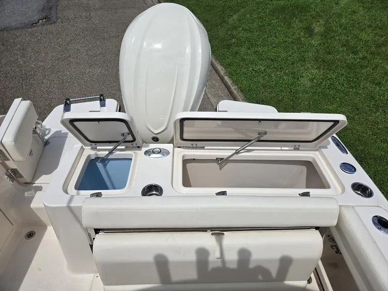 Slide: The Image of 2025 Grady-White Fisherman 236 boat with open storage compartments and seating. - 15