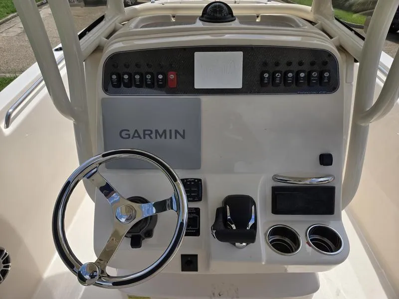 Slide: The Image of 2025 Grady-White Fisherman 236 boat dashboard with Garmin navigation system. - 17