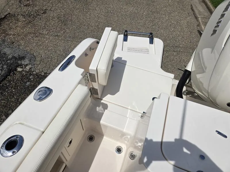 Slide: The Image of 2025 Grady-White Fisherman 236 boat deck with seating and engine view. - 3