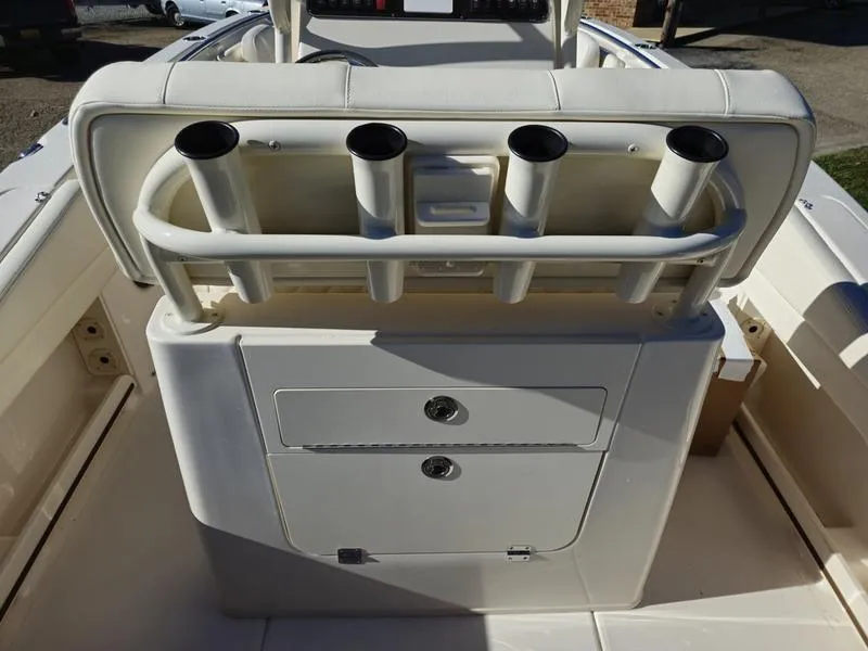 Slide: The Image of 2025 Grady-White Fisherman 236 boat console with rod holders and storage compartments. - 4