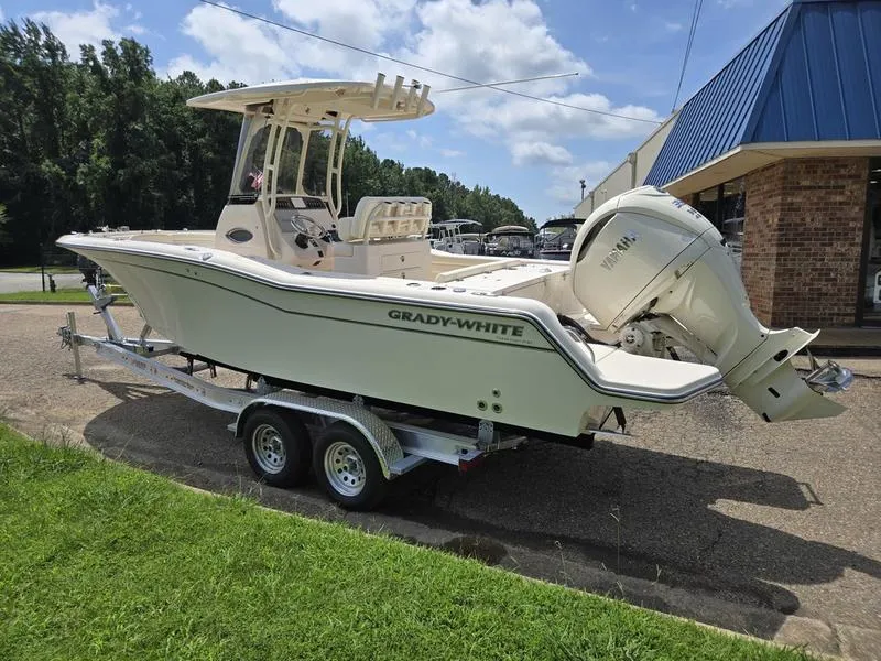 Slide: The Image of 2025 Grady-White Fisherman 236 boat on trailer, parked outdoors, side view. - 6