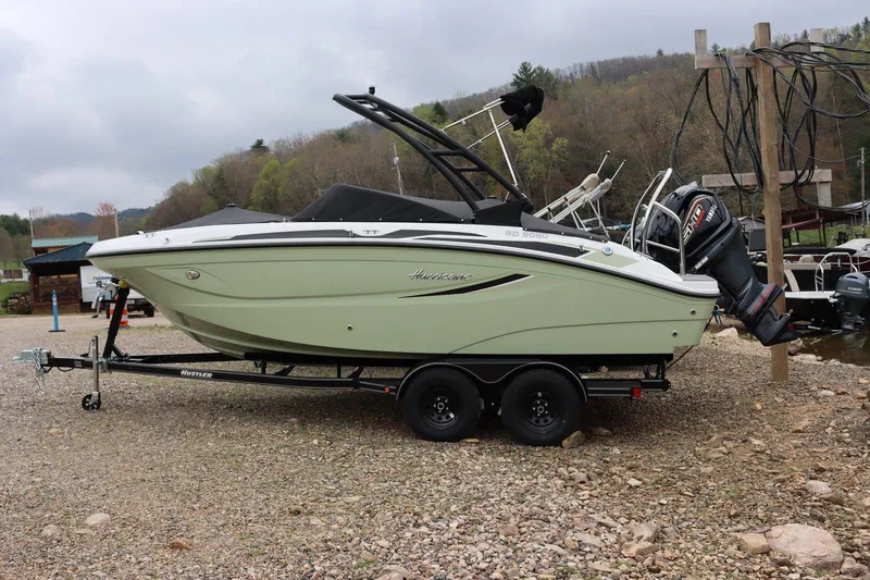 The Image of 2025 Hurricane SD2050-OB boat on trailer, parked on rocky terrain. - 0