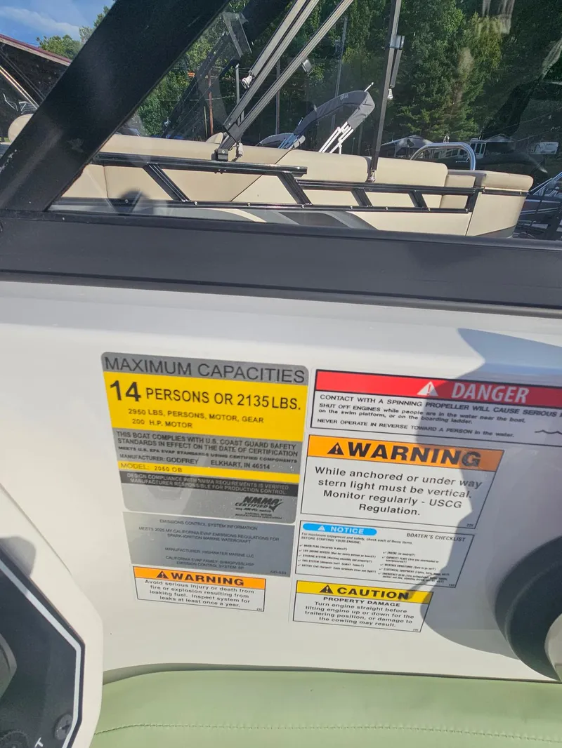Slide: The Image of Boat capacity and safety warnings on a 2025 Hurricane SD2050-OB. - 10