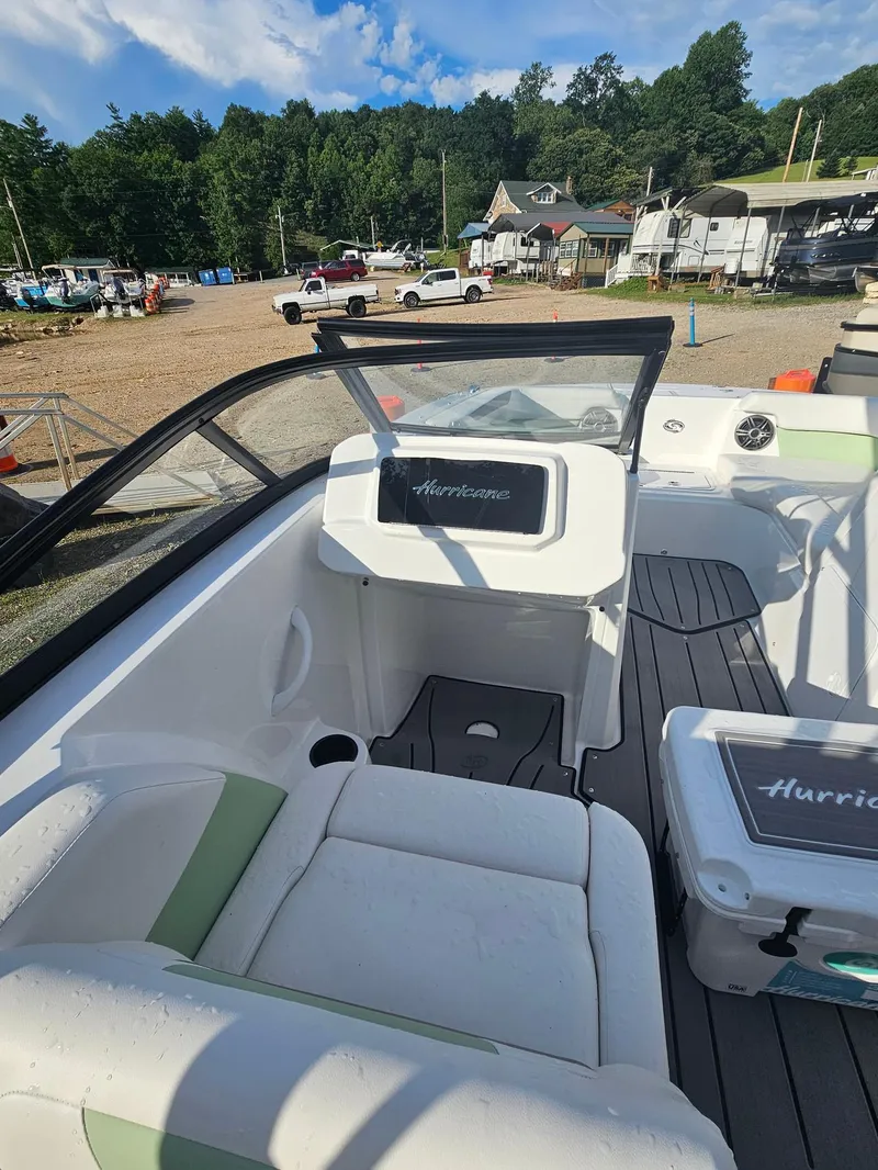 Slide: The Image of Interior of a 2025 Hurricane SD2050-OB boat with seating and dashboard. - 11