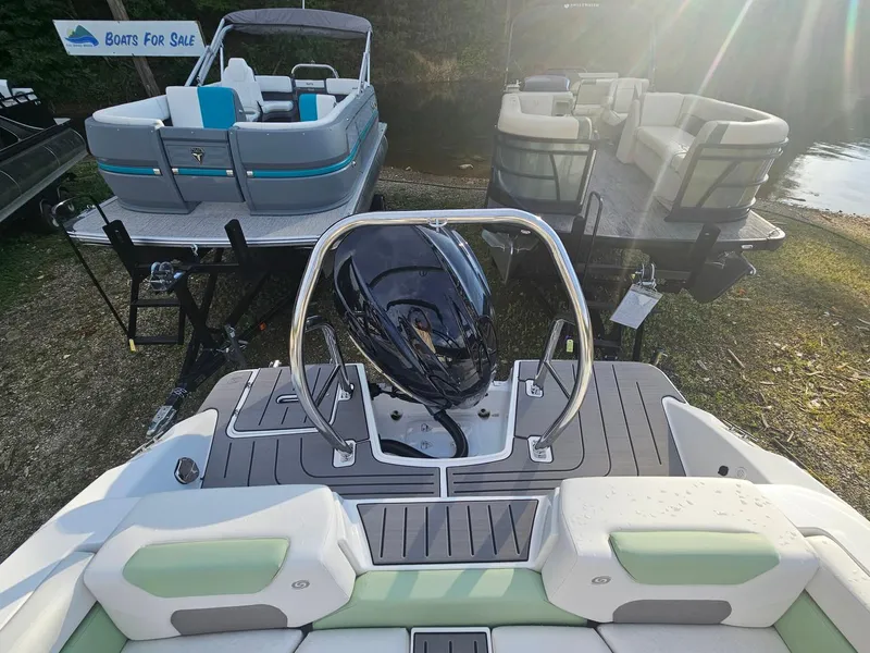 Slide: The Image of 2025 Hurricane SD2050-OB boat on display, surrounded by other boats for sale. - 16