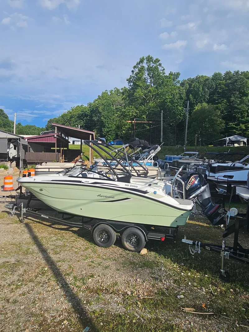 Slide: The Image of 2025 Hurricane SD2050-OB boat on trailer in outdoor storage area. - 3