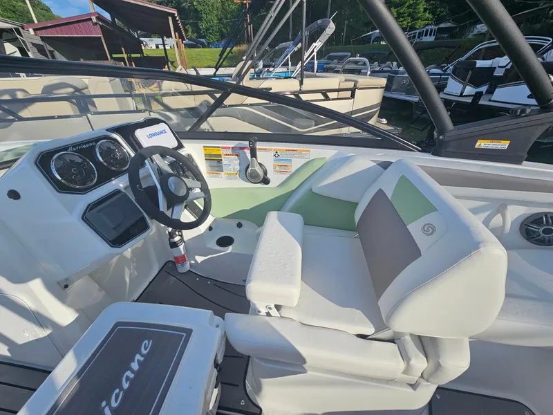Slide: The Image of 2025 Hurricane SD2050-OB boat cockpit with steering wheel and seating. - 8