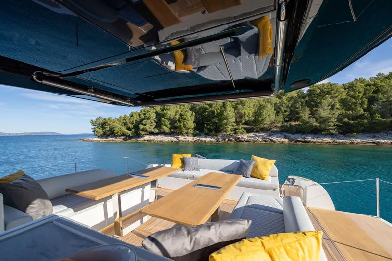 Slide: The Image of Luxurious deck of 2025 Solaris Power 60 Open yacht with scenic coastal view. - 15