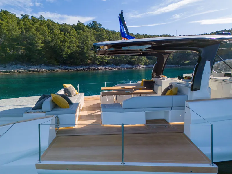 Slide: The Image of Luxurious deck of the 2025 Solaris Power 60 Open yacht with scenic coastal backdrop. - 18