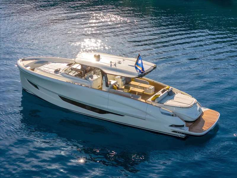 Slide: The Image of 2025 Solaris Power 60 Open luxury yacht cruising on clear blue water. - 2