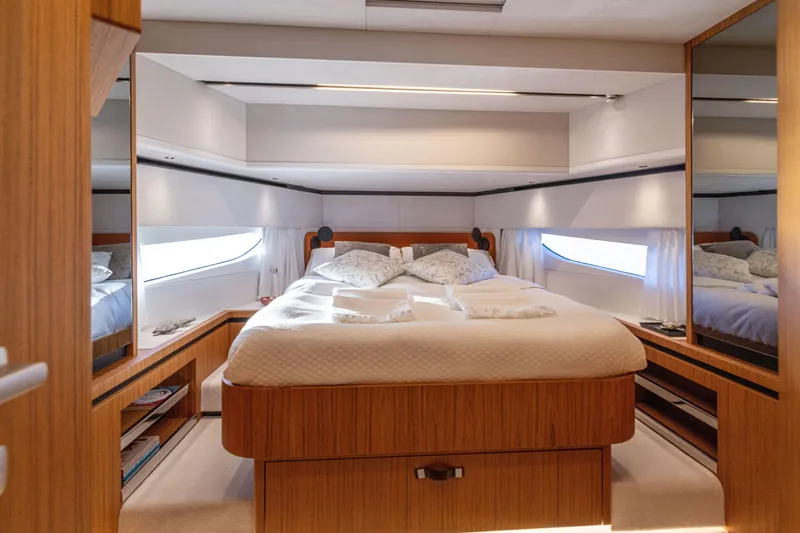 Slide: The Image of Luxurious bedroom interior of the 2025 Solaris Power 60 Open yacht. - 28
