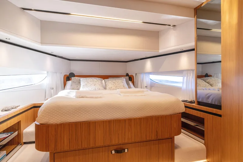 Slide: The Image of Luxurious bedroom interior of the 2025 Solaris Power 60 Open yacht. - 35