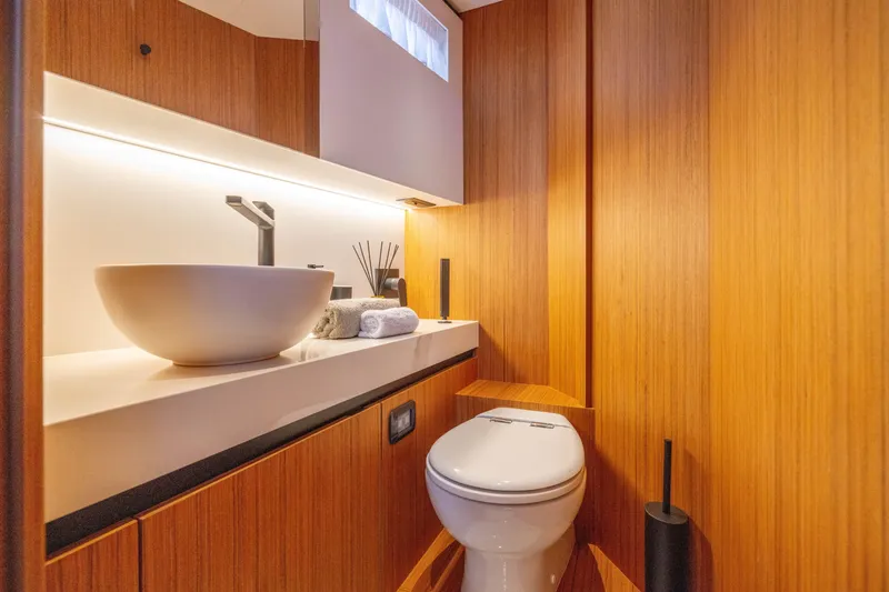 Slide: The Image of Luxurious bathroom in 2025 Solaris Power 60 Open yacht with modern fixtures and wooden accents. - 43