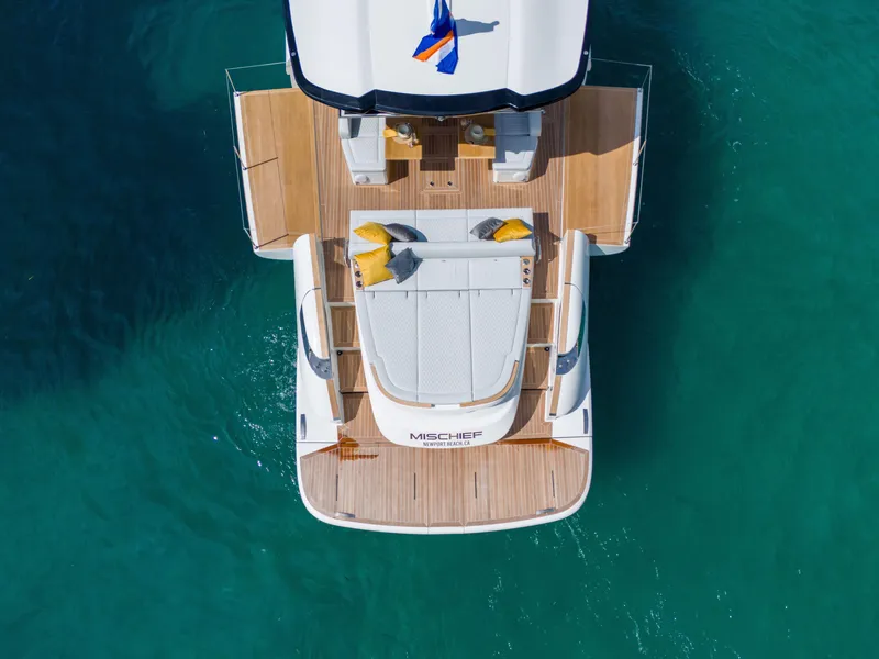 Slide: The Image of Aerial view of 2025 Solaris Power 60 Open yacht on turquoise water. - 7