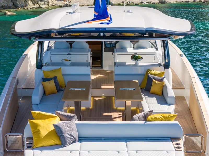 Slide: The Image of 2025 Solaris Power 60 Open luxury yacht with spacious seating and vibrant cushions. - 9