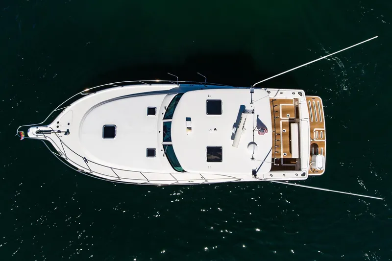 Slide: The Image of Overhead view of 2001 Tiara Yachts 3800 on dark water. - 10