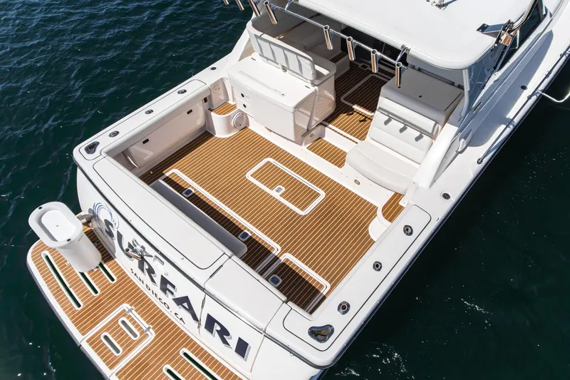 Slide: The Image of 2001 Tiara Yachts 3800 with spacious deck and seating, viewed from above. - 14