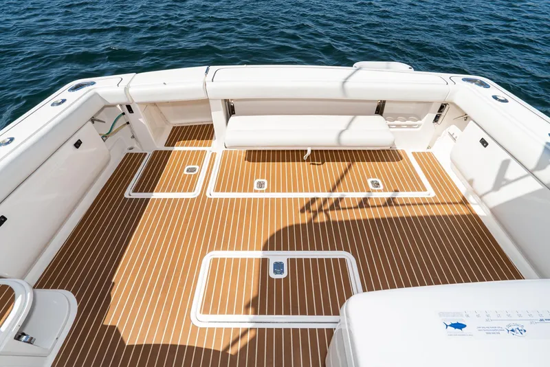 Slide: The Image of Tiara Yachts 3800, 2001 model, featuring spacious deck with teak flooring and seating. - 17