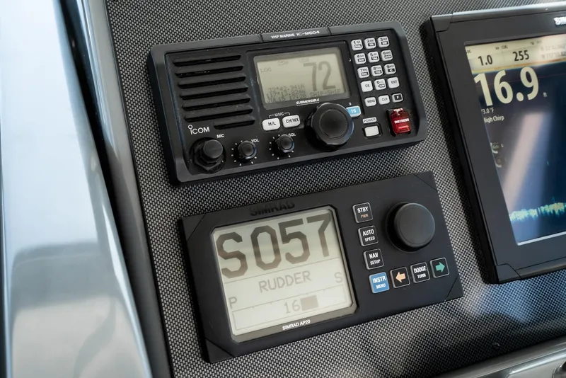 Slide: The Image of Control panel of a 2001 Tiara Yachts 3800 with navigation and communication equipment. - 27