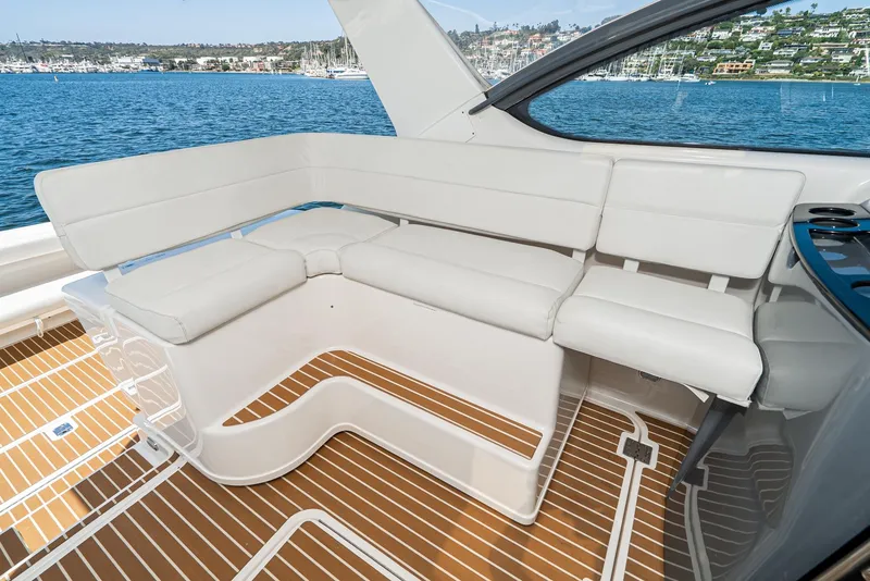 Slide: The Image of Luxurious seating on 2001 Tiara Yachts 3800, overlooking serene blue waters. - 29