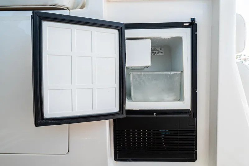 Slide: The Image of Open ice maker on 2001 Tiara Yachts 3800, showcasing interior compartment. - 32