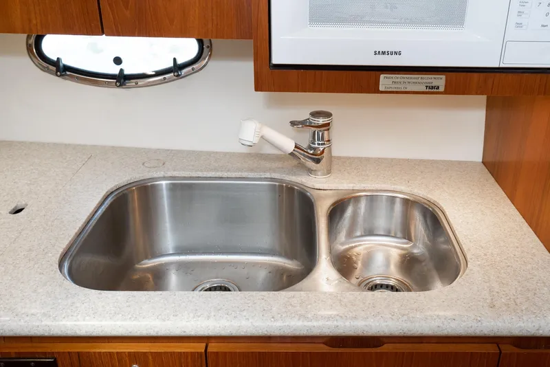 Slide: The Image of Stainless steel double sink in 2001 Tiara Yachts 3800, featuring modern faucet and countertop. - 36