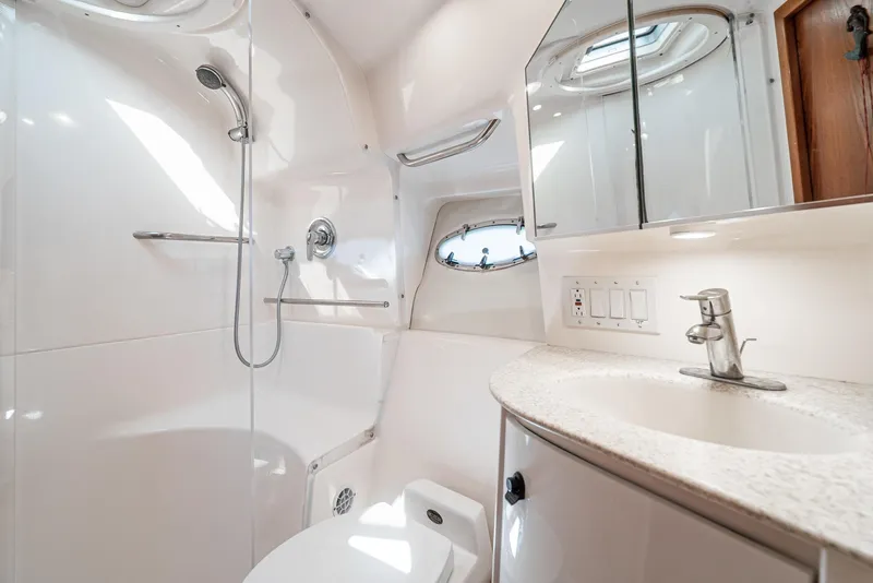 Slide: The Image of Luxurious bathroom in 2001 Tiara Yachts 3800, featuring modern fixtures and elegant design. - 48