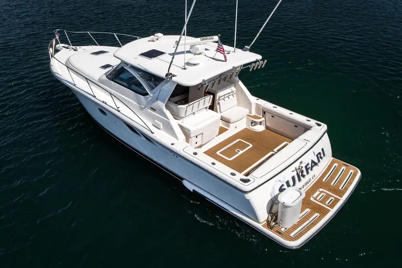 Slide: The Image of 2001 Tiara Yachts 3800 boat on water, aerial view, white exterior, spacious deck. - 5