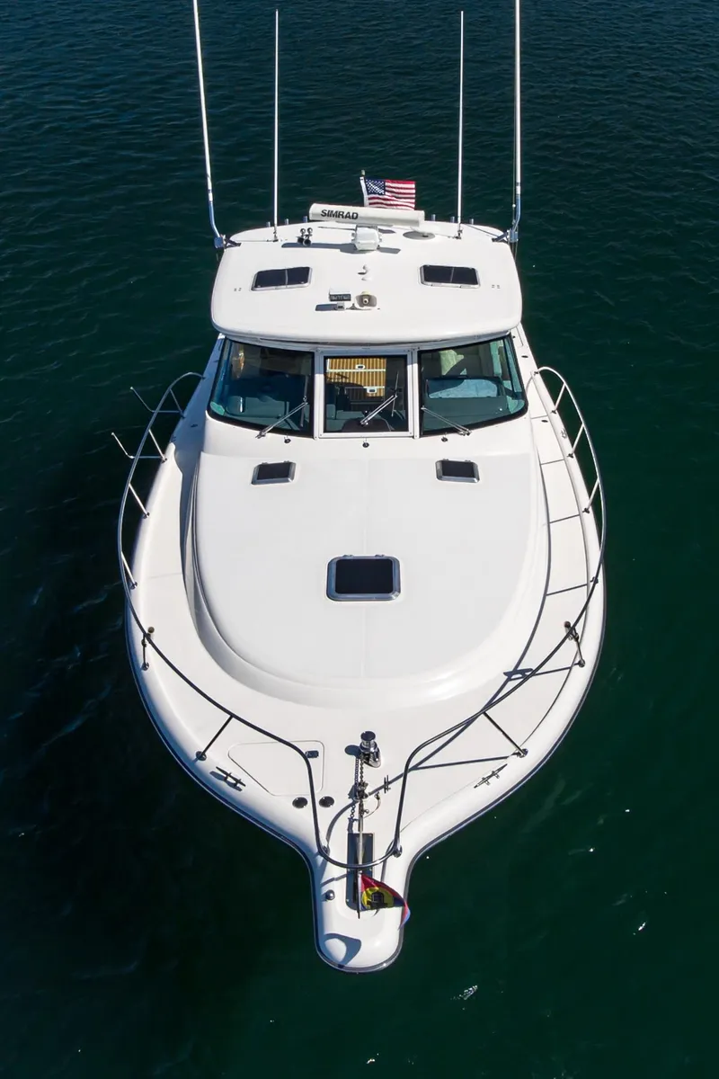 Slide: The Image of Tiara Yachts 3800, 2001 model, cruising on clear blue water. - 9