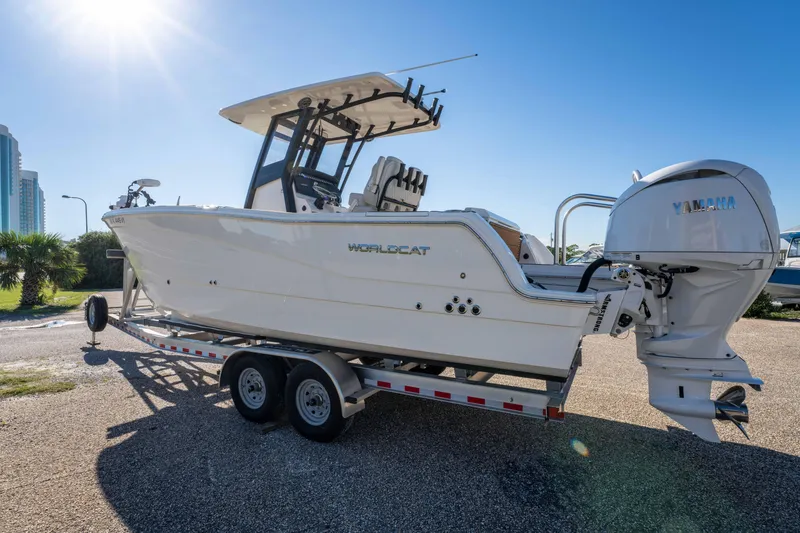 Slide: The Image of 2024 World Cat 260 CC-X boat on trailer, featuring Yamaha outboard engine. - 13