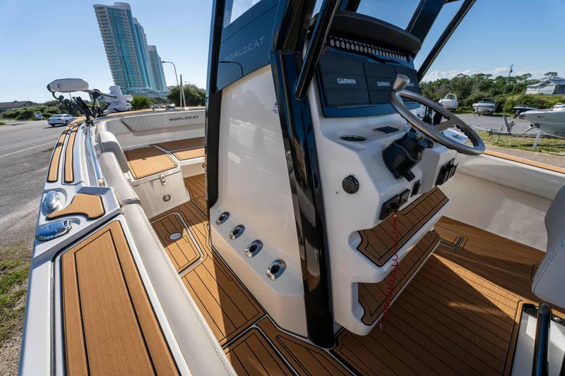 Slide: The Image of 2024 World Cat 260 CC-X boat interior with modern helm and teak flooring. - 16