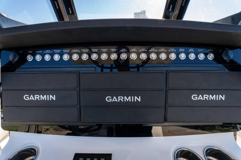 Slide: The Image of 2024 World Cat 260 CC-X dashboard with Garmin navigation displays and control switches. - 19