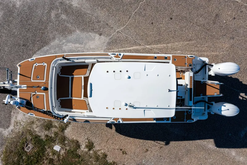 Slide: The Image of Overhead view of 2024 World Cat 260 CC-X boat on a gravel surface. - 2
