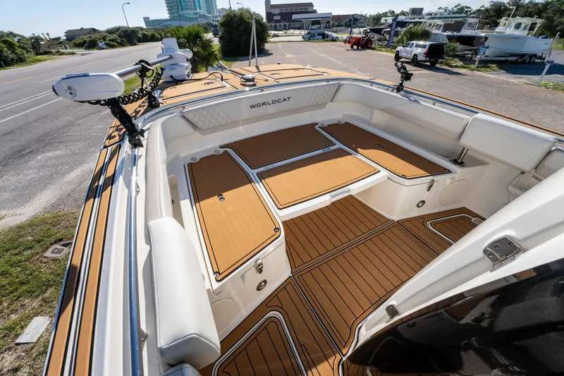Slide: The Image of 2024 World Cat 260 CC-X boat interior with teak flooring and storage compartments. - 22