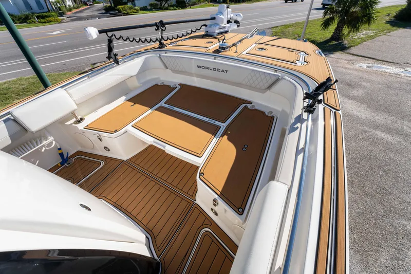 Slide: The Image of 2024 World Cat 260 CC-X boat interior with tan deck and storage compartments. - 24