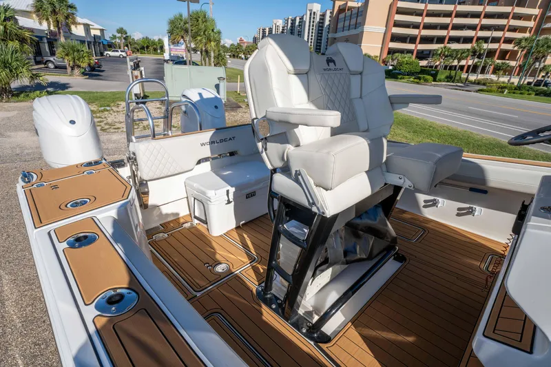 Slide: The Image of 2024 World Cat 260 CC-X boat interior with luxurious seating and teak flooring. - 25