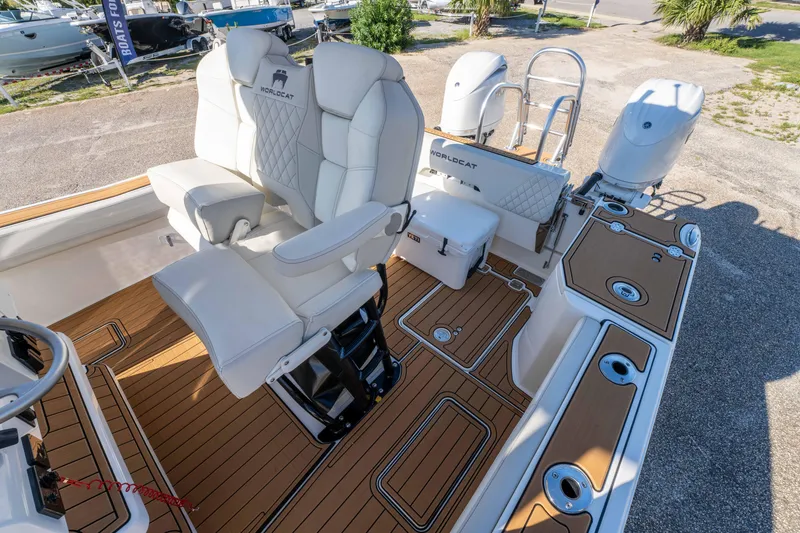 Slide: The Image of 2024 World Cat 260 CC-X boat interior with luxurious seating and teak flooring. - 28