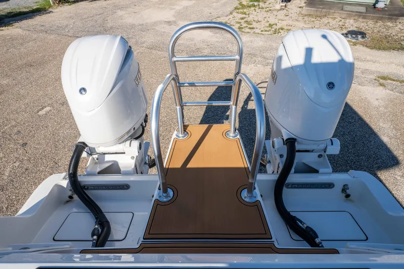 Slide: The Image of 2024 World Cat 260 CC-X boat with dual outboard engines and swim platform. - 29