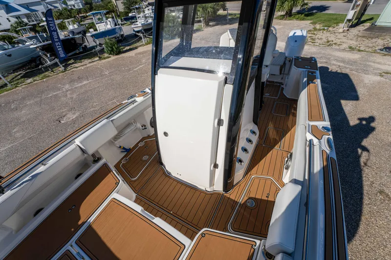 Slide: The Image of 2024 World Cat 260 CC-X boat interior with teak flooring and modern design. - 35