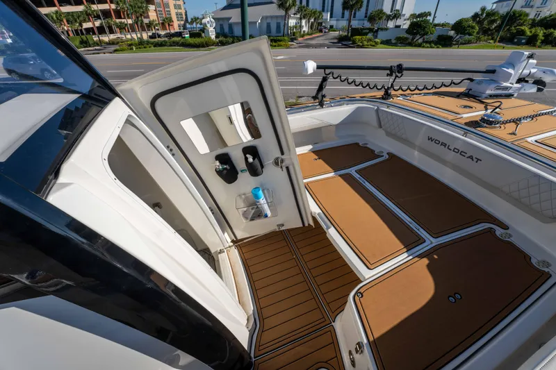 Slide: The Image of 2024 World Cat 260 CC-X boat interior with open door and deck view. - 36