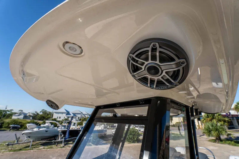 Slide: The Image of 2024 World Cat 260 CC-X boat with mounted speakers and overhead lighting. - 37