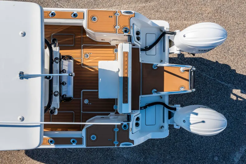 Slide: The Image of Overhead view of 2024 World Cat 260 CC-X boat with dual engines and teak deck. - 5