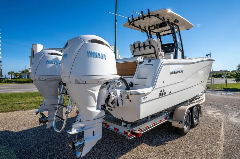 Slide: The Image of 2024 World Cat 260 CC-X boat with dual Yamaha engines on a trailer. - 9